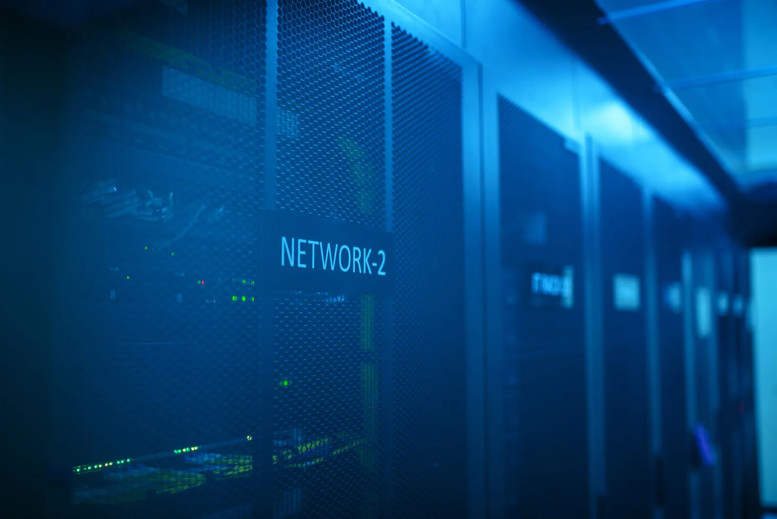 Blue-lit enterprise data center server room
